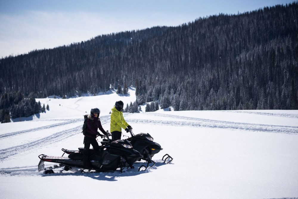 Couple Snowmobiling in Jackson Hole.